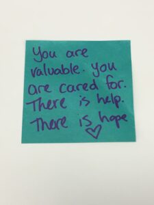On a teal post-it not