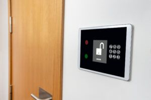 Close-up on an automated security system at a house locking the front door |