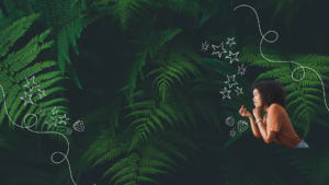 Woman holding strawberry in front of