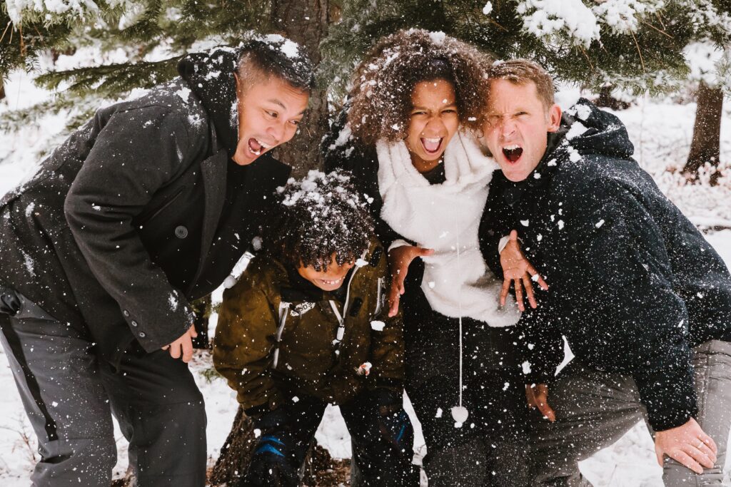 Four children playing in the snow