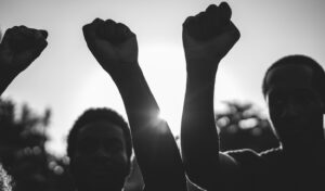 Black demonstrator people holding han