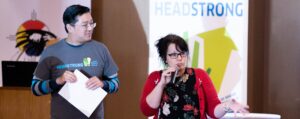 Man and women speaking at a conference