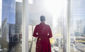 Portrait of contemplative Black businesswoman at window