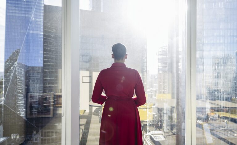 Portrait of contemplative Black businesswoman at window