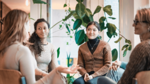 A person sharing their experiences during a support group