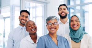 A group of diverse healthcare providers stand together
