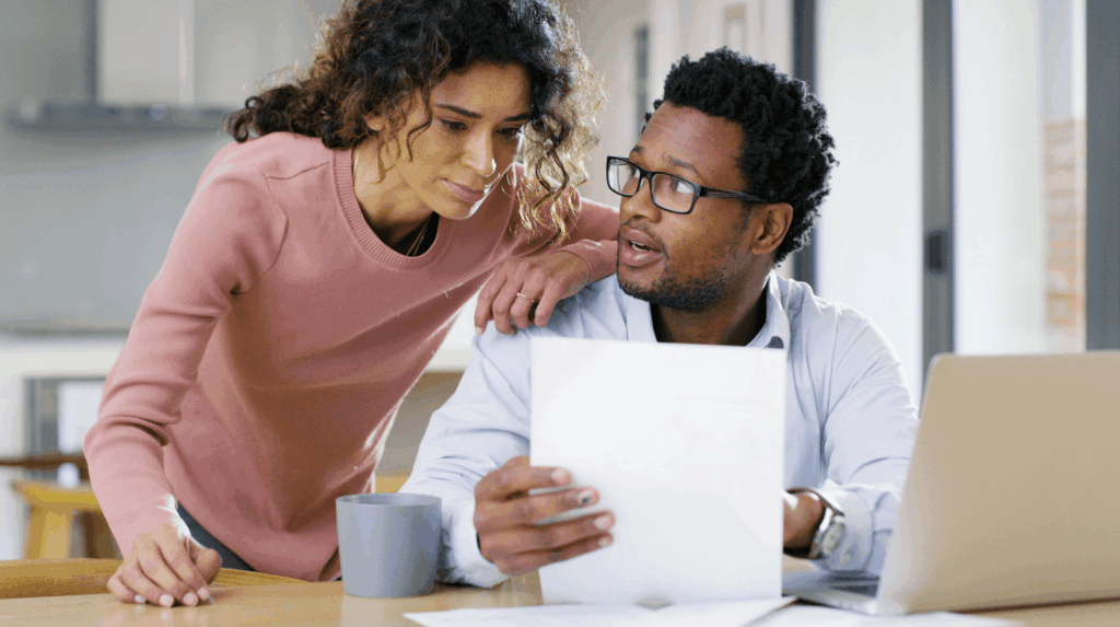 A couple in their home discussing their finances