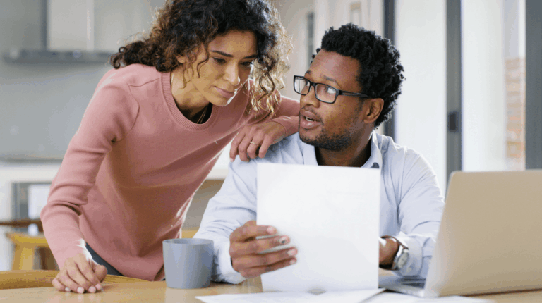 A couple in their home discussing their finances
