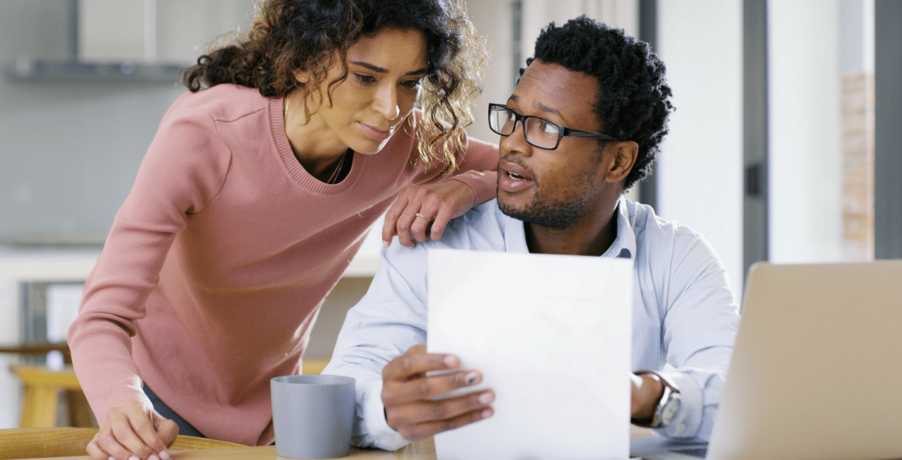 A couple in their home discussing their finances