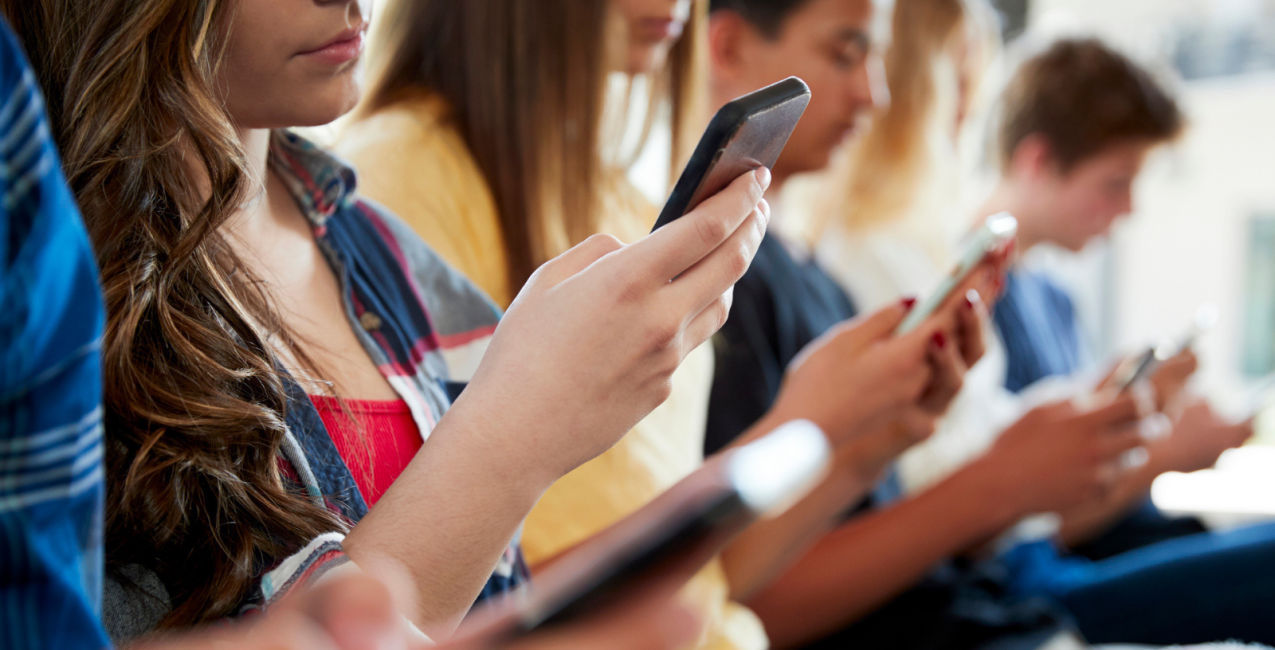 Students looking at their cellphones